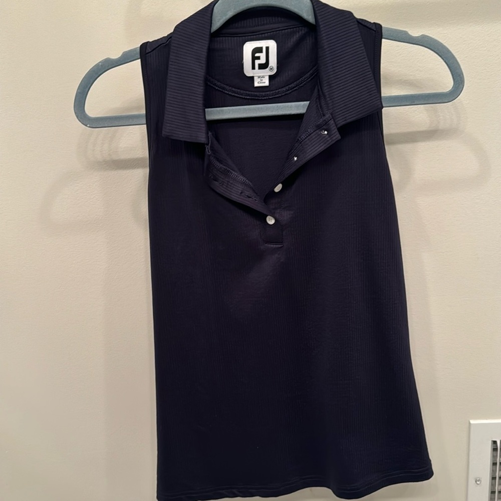 Foot joy women’s golf shirt.  Navy blue racer back.